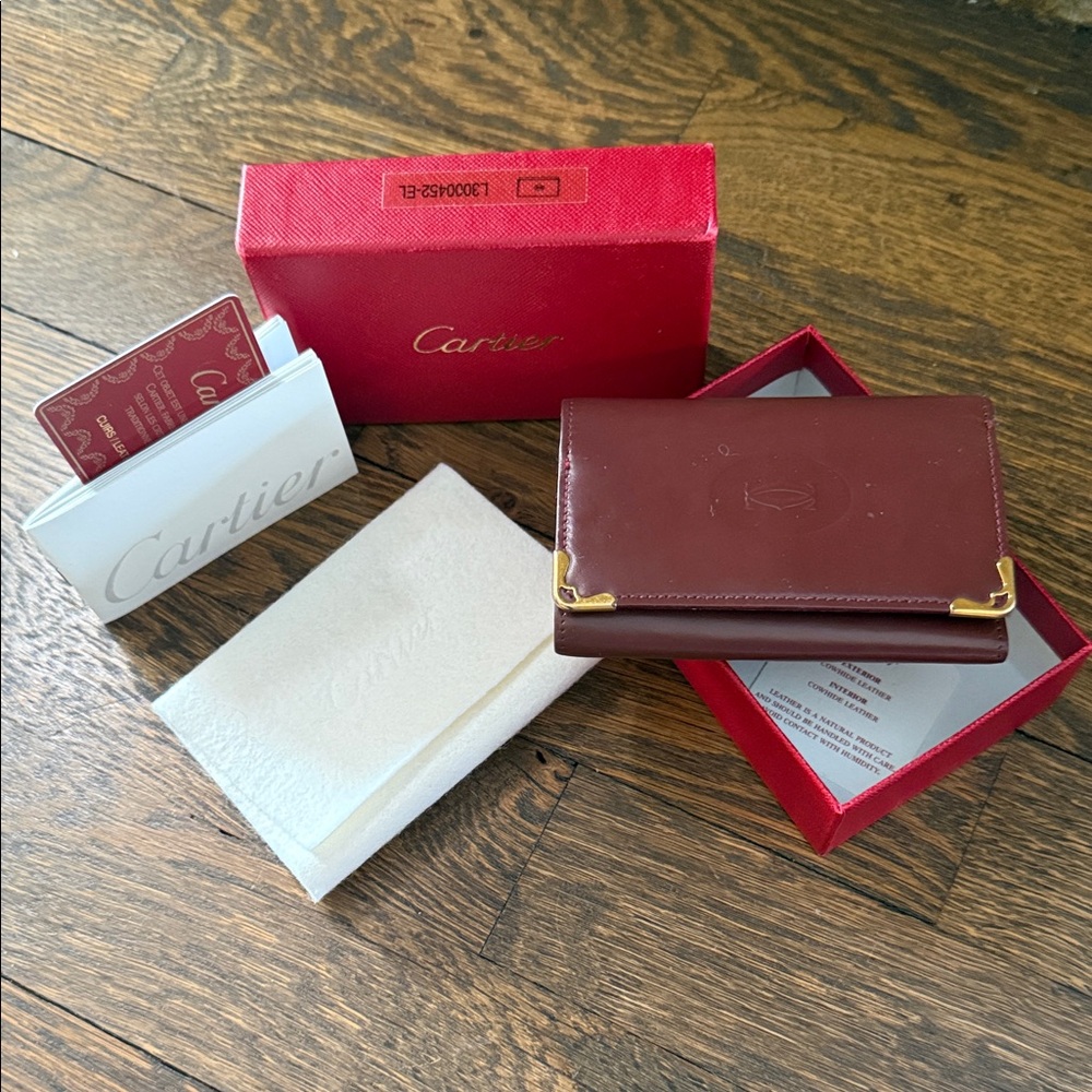 Cartier Burgundy Leather Key Card Holder with Gold plated corners  w/ box